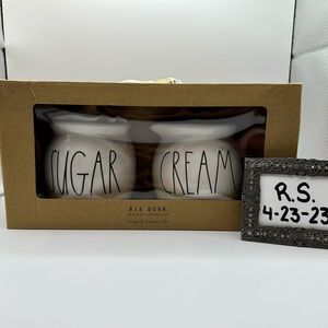 Rae Dunn “Sugar” pot and “Cream” pitcher.